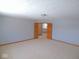 Spacious bedroom features neutral carpet and trim and double-door entry at 777 West St, Whiteland, IN 46184