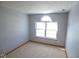 Neutral bedroom featuring carpet and a light-filled window at 777 West St, Whiteland, IN 46184