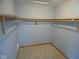 Walk-in closet with carpet flooring and wood shelving at 777 West St, Whiteland, IN 46184