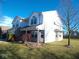 A side view of a two-story home featuring brick and siding, set on a green lawn under a bright sky at 777 West St, Whiteland, IN 46184