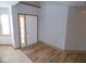 Entryway showcasing hardwood flooring and a bright white front door, with natural light from a side window at 777 West St, Whiteland, IN 46184