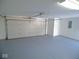 Clean, freshly painted garage featuring an automatic garage door opener at 777 West St, Whiteland, IN 46184