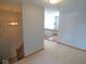 Open hallway featuring wood trim, plush carpet, and decorative light fixtures at 777 West St, Whiteland, IN 46184