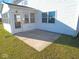 Outdoor patio area surrounded by grass and siding with window views into the home at 777 West St, Whiteland, IN 46184
