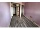 Standard bedroom with open closet and gray wood flooring at 8328 S Franklin Rd, Indianapolis, IN 46259