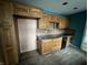 Spacious kitchen with wood cabinets, countertops, backsplash, appliances, and wood flooring at 8328 S Franklin Rd, Indianapolis, IN 46259
