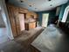 Open kitchen featuring wood cabinets, countertops, backsplash, stainless range hood, and wood flooring at 8328 S Franklin Rd, Indianapolis, IN 46259