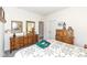 Bedroom with ornate dressers, mirror, and white walls at 936 Plunkett Ave, Westfield, IN 46074