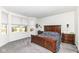 Bright bedroom features a large window, natural light, and classic wood furniture at 936 Plunkett Ave, Westfield, IN 46074