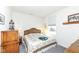 Cozy bedroom with natural light, lamps on bedside tables and neutral colored bedding at 936 Plunkett Ave, Westfield, IN 46074