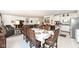 Open-concept dining room features a dining table and a view into the kitchen and living area at 936 Plunkett Ave, Westfield, IN 46074