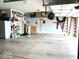 Well-organized garage with shelving, ladders, wreaths, and ample storage space at 936 Plunkett Ave, Westfield, IN 46074
