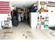 Spacious garage with ample storage, shelving, and an American flag hanging on the wall at 936 Plunkett Ave, Westfield, IN 46074