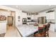 Bright kitchen featuring white cabinets, stainless steel appliances, a large island, and an adjacent dining area at 936 Plunkett Ave, Westfield, IN 46074