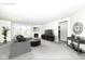Bright living room features a cozy fireplace, plush gray sofa, and large windows for ample natural light at 936 Plunkett Ave, Westfield, IN 46074