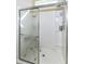 Updated shower with glass door and accessible seating at 936 Plunkett Ave, Westfield, IN 46074
