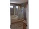 Bright bathroom featuring a tiled shower, a soaking tub, and neutral toned walls at 9808 Worthington Blvd, Fishers, IN 46038