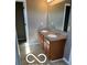 Bathroom featuring double sinks, a mirror, and a tiled floor at 9808 Worthington Blvd, Fishers, IN 46038