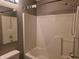 A full bathroom featuring a shower and tub combo with tile walls and a large mirror at 9808 Worthington Blvd, Fishers, IN 46038