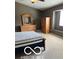 Spacious bedroom with neutral walls and flooring, natural light, and dresser at 9808 Worthington Blvd, Fishers, IN 46038