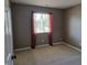 Bedroom featuring neutral carpeting, paint and window with a view of the outdoors at 9808 Worthington Blvd, Fishers, IN 46038