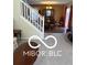 Open-concept view of dining area and a staircase leading to additional rooms at 9808 Worthington Blvd, Fishers, IN 46038
