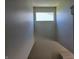 The well-lit staircase features neutral walls, offering a glimpse of the bright and airy upstairs hallway at 9808 Worthington Blvd, Fishers, IN 46038