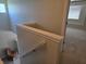 Hallway with staircase and carpet, featuring an open door to an adjacent room at 9808 Worthington Blvd, Fishers, IN 46038