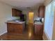 Open kitchen design featuring dark cabinets, stainless steel appliances, and ample counterspace at 9808 Worthington Blvd, Fishers, IN 46038