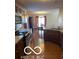 Well-equipped kitchen flowing to dining area, featuring ample counter space and dark wood cabinets at 9808 Worthington Blvd, Fishers, IN 46038