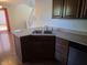 Kitchen featuring stainless steel appliances, dark cabinets, and a dual basin sink at 9808 Worthington Blvd, Fishers, IN 46038