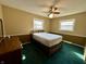 Comfortable bedroom featuring a bed, two windows, and dark wood furnishings at 1031 Schleicher Ave, Indianapolis, IN 46229