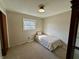 This cozy bedroom features a bed, a window, closet and neutral colored walls at 1031 Schleicher Ave, Indianapolis, IN 46229