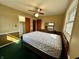 Comfortable bedroom featuring a bed, two windows, and dark wood furnishings at 1031 Schleicher Ave, Indianapolis, IN 46229
