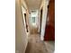 Hallway with carpet and doors in the interior of the home at 1031 Schleicher Ave, Indianapolis, IN 46229