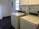 This laundry room features a washer and dryer, perfect for convenient laundry days at 1031 Schleicher Ave, Indianapolis, IN 46229