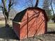 Exterior view of red storage shed on the property at 1031 Schleicher Ave, Indianapolis, IN 46229