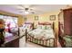 Bedroom with two double beds, ceiling fan, and neutral walls and carpet at 10535 Pokagon Way, Indianapolis, IN 46239