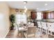 Dining area with a white table set and a sliding door that opens to the backyard at 10535 Pokagon Way, Indianapolis, IN 46239