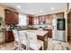 Well-equipped kitchen featuring stainless steel appliances, dark cabinets, and a center island at 10535 Pokagon Way, Indianapolis, IN 46239