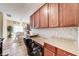 Kitchen area with counter seating, lots of cabinet space, and view into the dining room at 10535 Pokagon Way, Indianapolis, IN 46239
