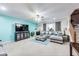 Comfortable living room with fireplace, large sectional sofa, and a view of the staircase at 10535 Pokagon Way, Indianapolis, IN 46239