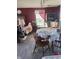 Cozy dining room featuring hardwood floors, natural light, and classic furniture at 10793 Walnut Grove Bnd, Camby, IN 46113