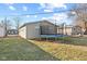 View of the backyard with a trampoline, grass, and surrounding homes in a residential neighborhood at 1131 Madeira St, Indianapolis, IN 46203