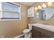 Updated bathroom with modern vanity, decorative mirror, and vinyl floor at 1131 Madeira St, Indianapolis, IN 46203