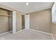 Bedroom with neutral carpet and a closet with bi-fold doors open at 1131 Madeira St, Indianapolis, IN 46203