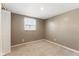 Neutral bedroom featuring a window, a closet, and beige carpeting at 1131 Madeira St, Indianapolis, IN 46203