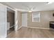 Bright living room featuring neutral walls, ceiling fan, and wood-look flooring at 1131 Madeira St, Indianapolis, IN 46203