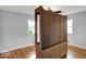 Spacious bedroom with hardwood floors and natural light from two windows at 120 E Beechwood Ln, Indianapolis, IN 46227