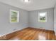 This room features hardwood flooring, two windows and neutral paint at 120 E Beechwood Ln, Indianapolis, IN 46227